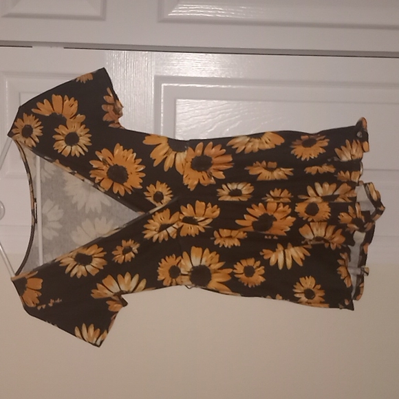 This is a beautiful romper from Shein, it has beautiful sunflower prints. - Picture 2 of 4